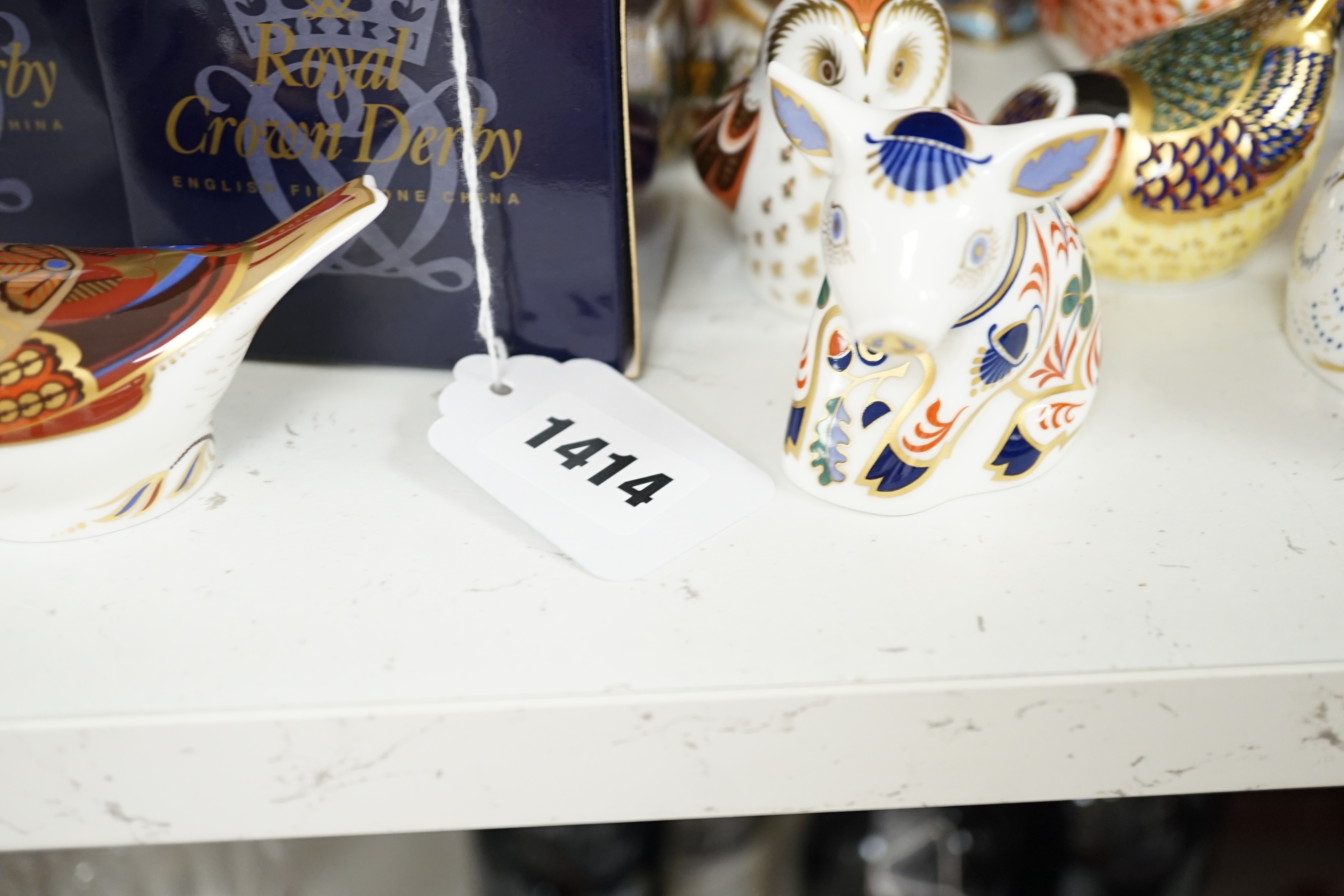 Approximately thirty-two Royal Crown Derby Imari porcelain paperweights, all but two with original boxes and mostly gold bottoms
